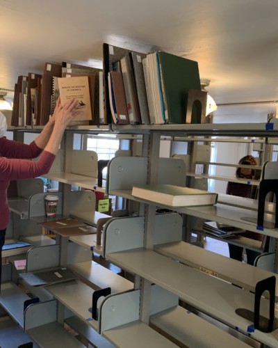 Hoffman sorting and shelving Special Collections archival books in Fraser 210, Spring 2021 Hoffman sorting and shelving Special Collections archival books in Fraser 210,Spring 2021