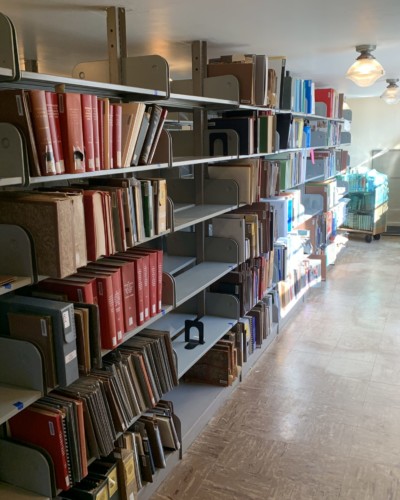 Fraser 210 stacks with some books shelved, open spaces waiting for other books to be sorted and shelved Fraser 210 with some books shelved, open spaces waiting for other books to be sorted and shelved