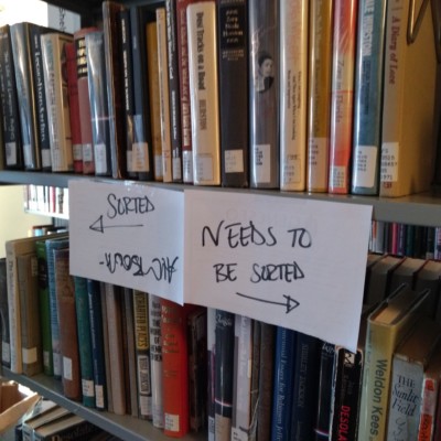 Signs noting which books are left to be sorted and which ones are completed, June 2021 Signs noting which books are left to be sorted and which ones are completed, June 2021