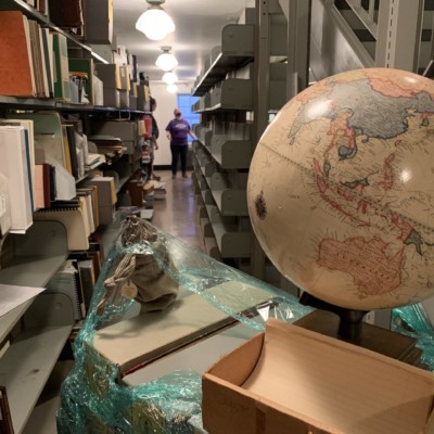 Globe and other Collection objects awaiting placement in Fraser Hall Library, spring 2021 Special Collections items required extra care in transport and storing. Globe and other Special Collection objects awaiting placement in Fraser Hall Library, spring 2021