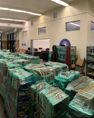 Wrapped books on trucks lined up in Fraser Hall, Spring 2021 Wrapped books on trucks lined up in Fraser Hall, Spring 2021