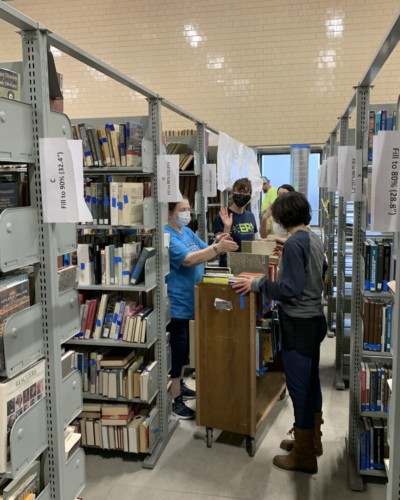 Library Staff Hanna, Root, Argentieri, Hoffman sorting and shelving books in Fraser 210, Spring 2021 Library Staff Hanna, Root, Argentieri, Hoffman sorting and shelving books in Fraser 210, Spring 2021