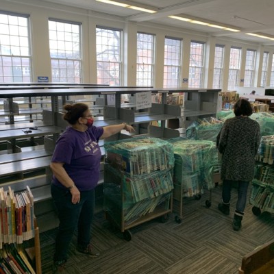 Root and Hanna unwrapping and sorting books in TERC, spring 2021 Root and Hanna unwrapping and sorting books in TERC