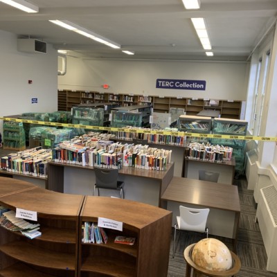 Books wrapped and stationed in the new TERC area to be unwrapped , sorted, and shelved, spring 2021 Books wrapped and stationed in the new TERC area to be unwrapped , sorted, and shelved